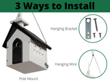 Product image showing three ways to install a white and black church-shaped birdhouse with a steeple, using a hanging bracket, wire, and pole mount, featuring tiny decorative windows and a dark gray door
