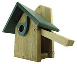Wooden birdhouse with a dark gray roof and a light wood slide featuring a bird-shaped entrance hole and brass colored screws
