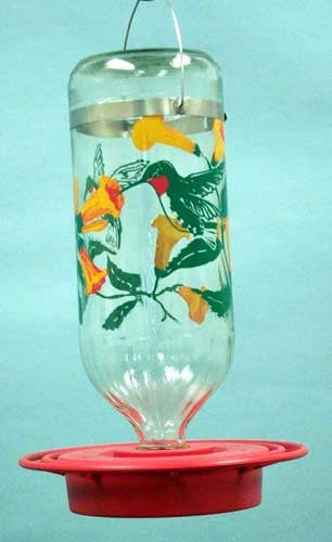 Hand-painted glass hummingbird feeder featuring ruby-throated hummingbirds and orange flowers on a red base with a metal hanger