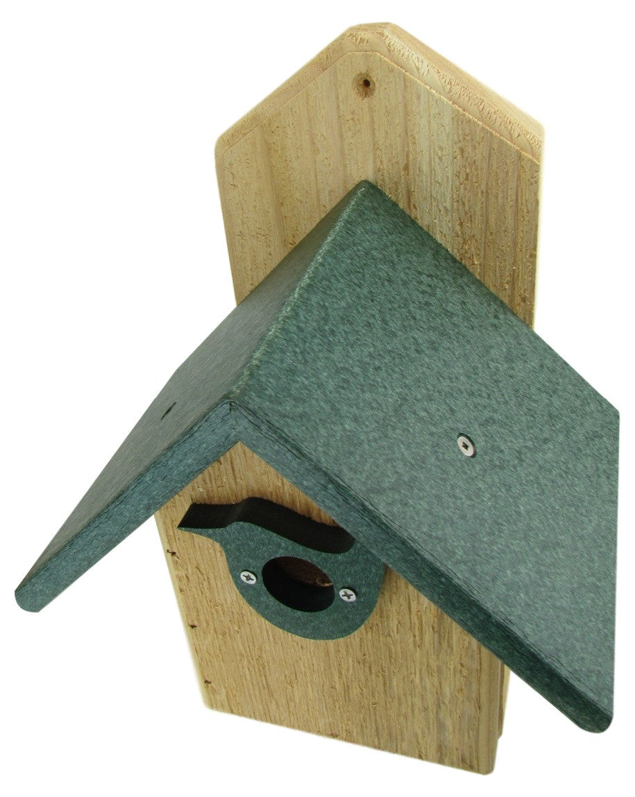 Wood and plastic birdhouse featuring a dark green roof light brown wood siding and a sculpted bird detail on the entrance