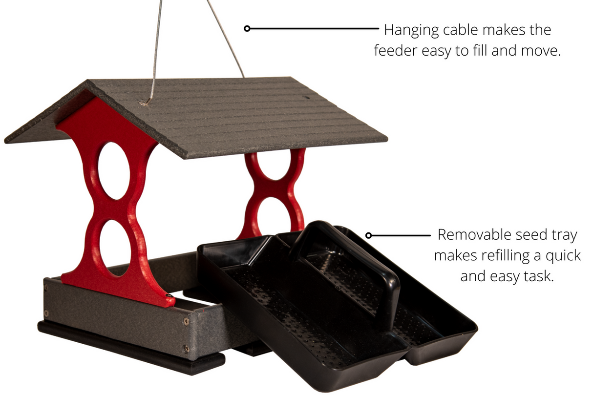 Product shot of a red and gray plastic bird feeder with a removable tray and hanging cable showing  a dark gray peaked roof and  two convenient black seed trays
