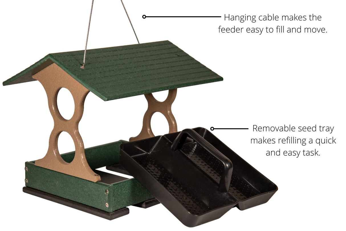 Product shot of a green and tan plastic bird feeder with a removable black tray featuring a pitched roof and hanging cable showing details like the textured surface and two circular openings
