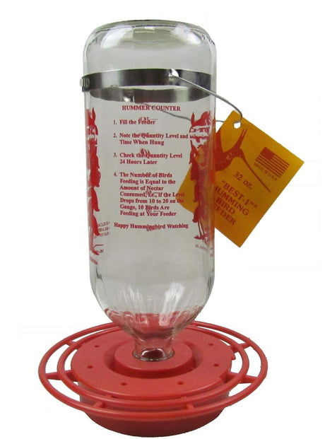 Product photo of a Best-1 32 oz glass hummingbird feeder with a red base showing a hummingbird and instructions for counting birds with vibrant red and orange accents.
