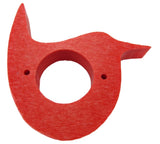 Red wooden bird-shaped object with a central hole and two small holes on the sides showing wood grain texture
