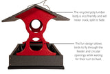Recycled poly lumber bird feeder featuring a red body, gray base, and a dark gray roof showcasing circular openings for birds to fly through.
