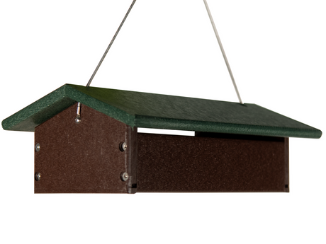 Recycled plastic bird feeder featuring a dark brown tray with a green roof and silver hanging wire showing visible screws and a textured surface
