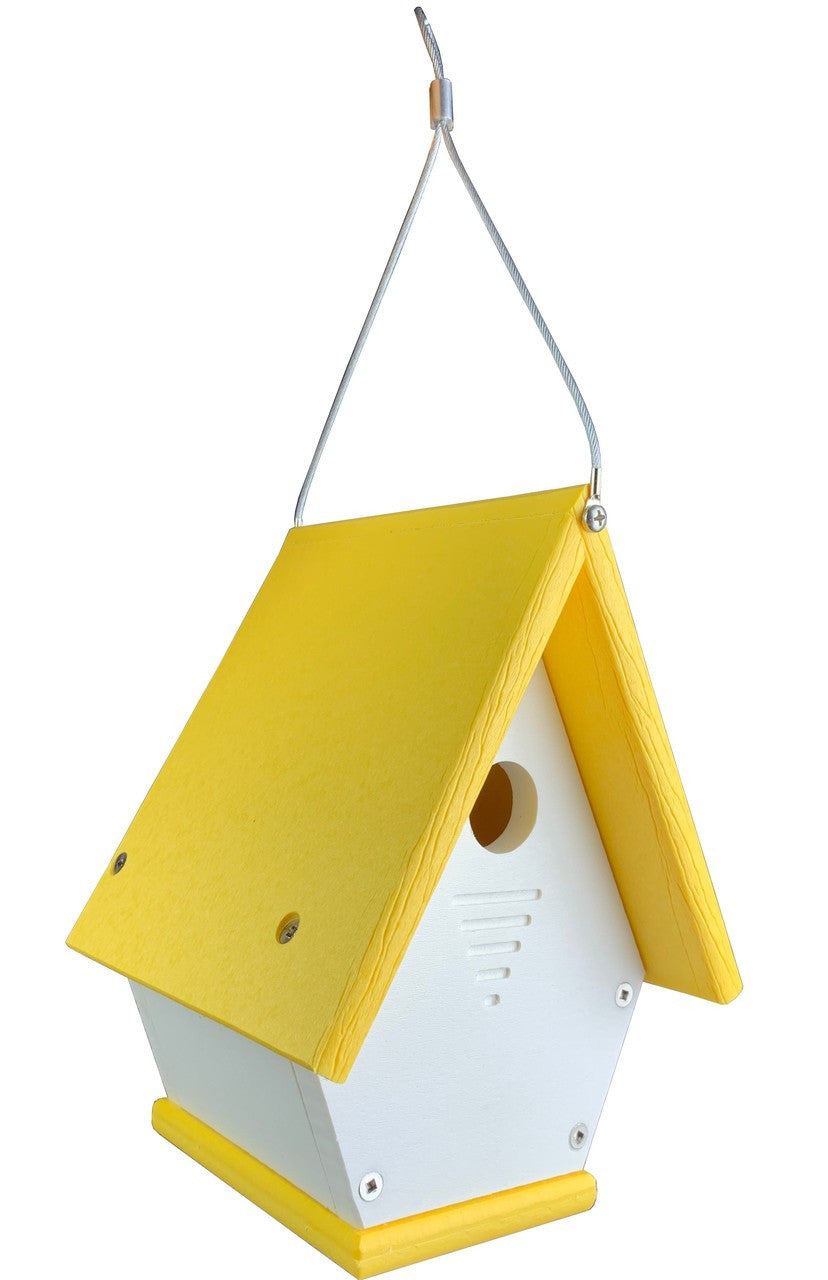 Plastic birdhouse with a bright yellow roof and white body featuring ventilation slots and a hanging wire a charming addition to any garden
