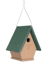 Recycled plastic birdhouse with dark green roof, tan body, and ventilation slots hanging from a wire cable