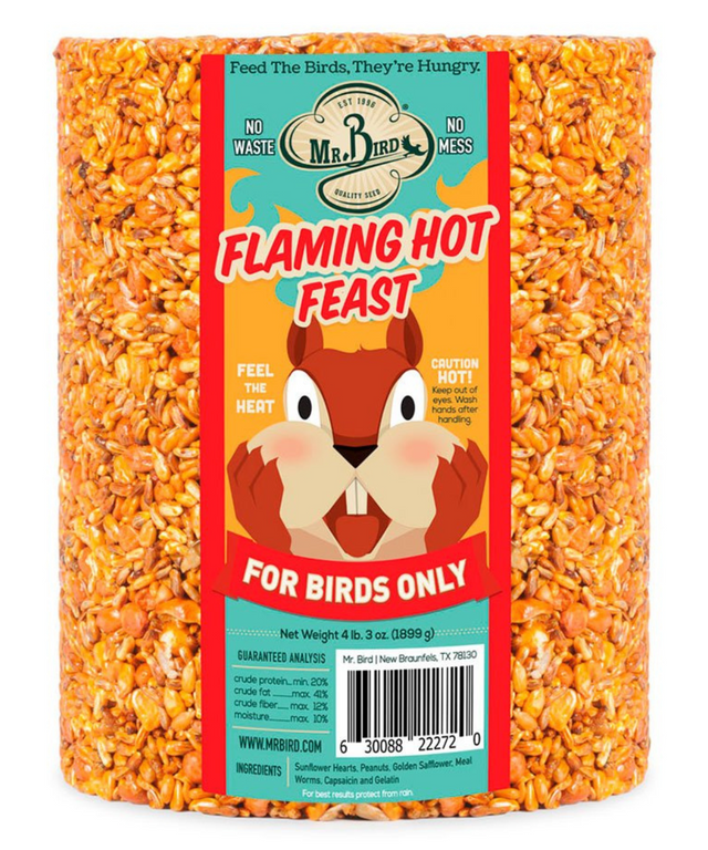Mr Bird's Flaming Hot Feast bird food cylindrical package shows a cartoon squirrel New Braunfels Texas featuring vibrant orange seeds and a cautionary label
