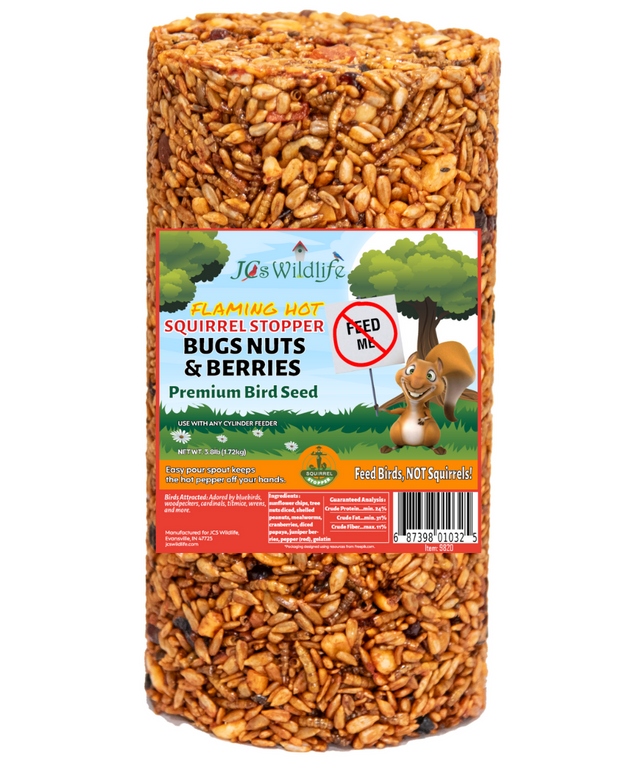 JCS Wildlife Flaming Hot Squirrel Stopper Bugs Nuts & Berries Premium Bird Seed shows a cylindrical package of birdseed containing sunflower seeds, berries, and mealworms against a white background
