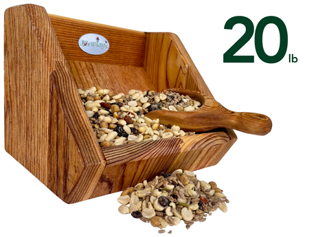 JGs Wildlife wooden bird feeder filled with 20 pounds of birdseed including peanuts sunflower seeds and raisins showcasing rich wood grain and a small wooden scoop
