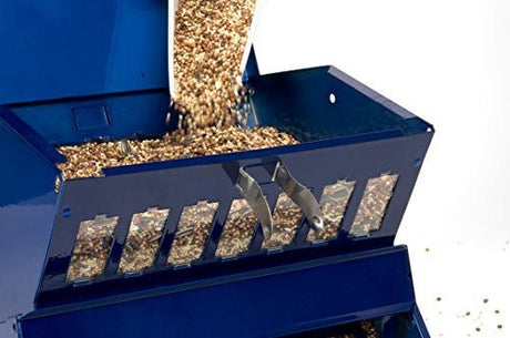 Durable Electric Blue Woodlink Absolute II Squirrel Resistant Bird Feeder being filled with bird seed.