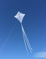In the Breeze White Colorfly 30" diamond kite flying in blue sky with three long white tails