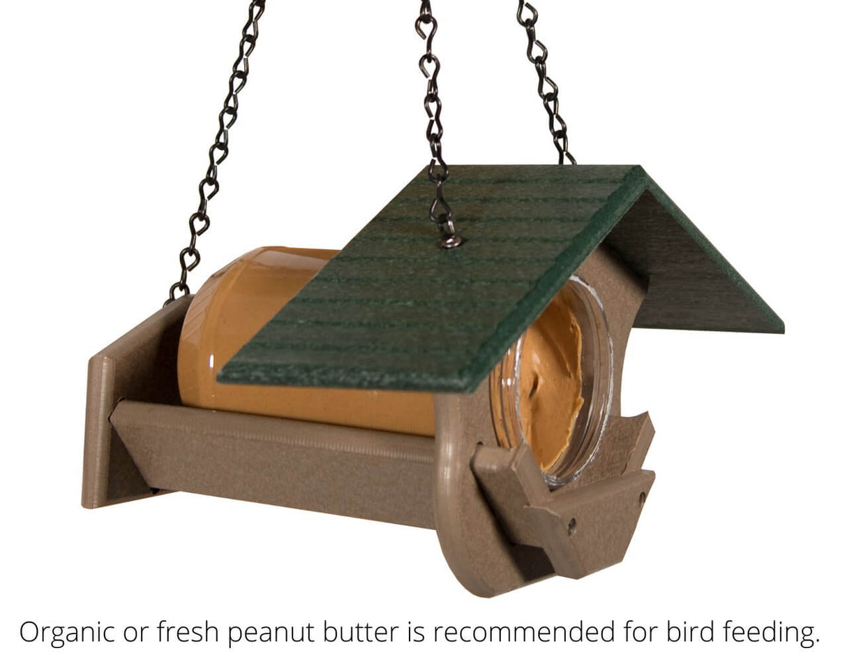 JCS Wildlife PB Pit Stop Peanut Butter Feeder hanging with jar for bird feeding, eco-friendly and weather-resistant design.