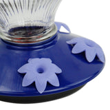 Close-up of Perky-Pet Grand Oasis Top-Fill Glass Hummingbird Feeder with floral feeding ports and wide-mouth design.