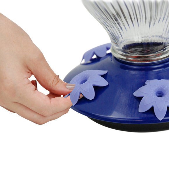 Hand assembling Perky-Pet Grand Oasis Top-Fill Glass Hummingbird Feeder with flower-shaped feeding ports