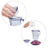 Demonstrating the easy top-fill design of the Perky-Pet Lavender Field Glass Hummingbird Feeder with wide-mouth opening and pouring nectar.