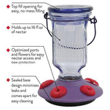 Perky-Pet Lavender Field Top-Fill Glass Hummingbird Feeder 16 oz with labeled features including top-fill opening, 16 oz capacity, and easy cleaning